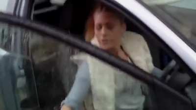 Woman holding a child spits on man after being confronted for parking on his property&hellip;