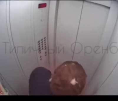 Guy checks if his vodka is flammable in the elevator
