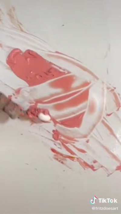 This guy perfectly nails a salmon color by mixing paint