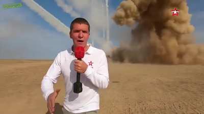 A Russian reporter in his natural habitat.