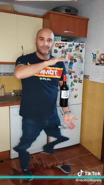 man wastes a bottle of wine