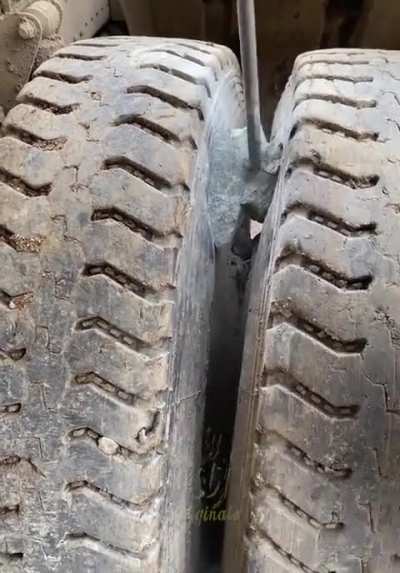 breaking a rock stuck between tires
