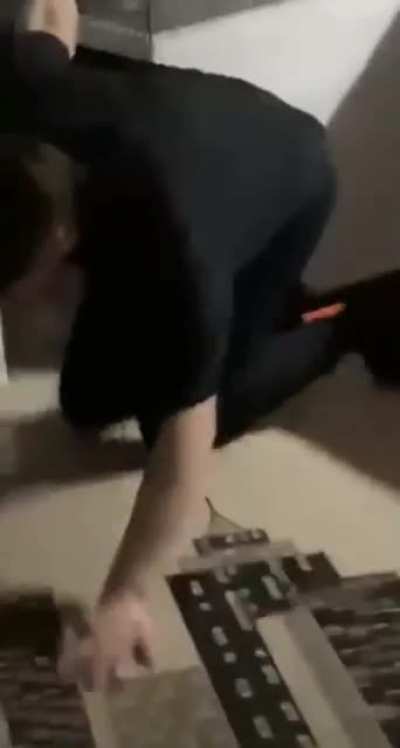 Taking pizza out of oven