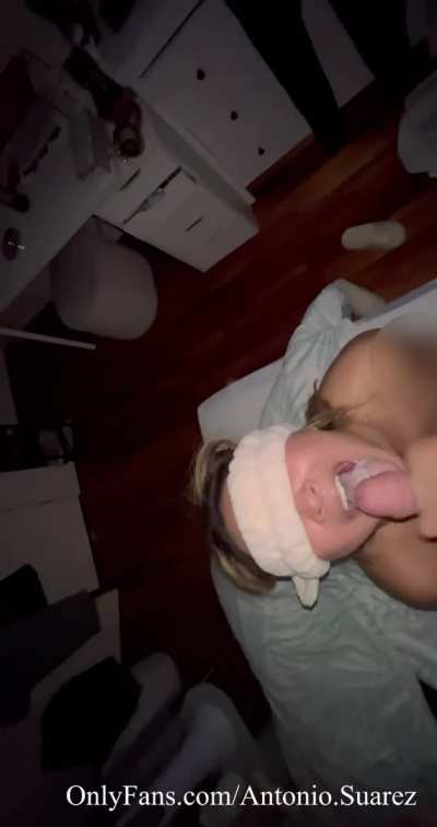 Smiling and guzzling cum