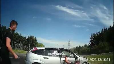 Man dangling from window gets hit by oncoming car