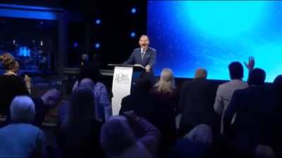Satan wearing a skin-suit laughing with church goers about the election