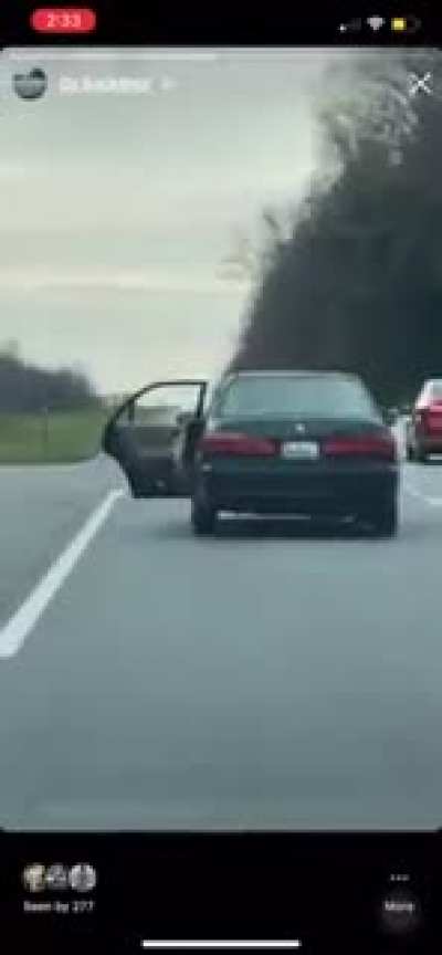 Marylander drives across narrow bridge with door open to haul a TV