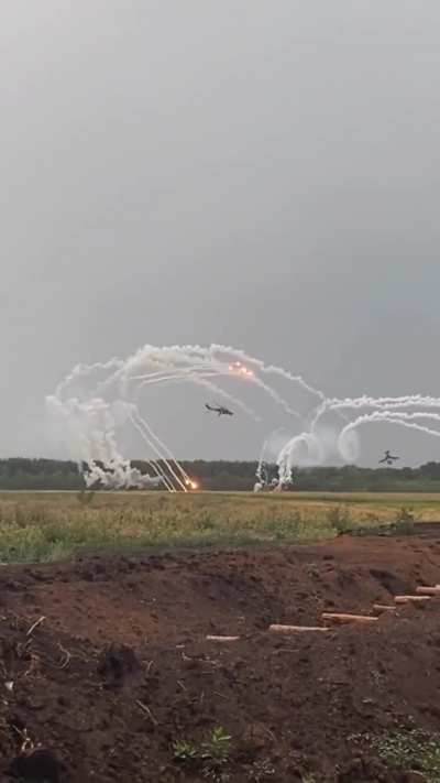 JTAC team recording a pair of Mil Mi-24 attack helicopters from the Ground Forces Aviation firing rockets in a parabolic trajectory at pre-designated targets. Published on September 11, 2024 by UTAC Team.