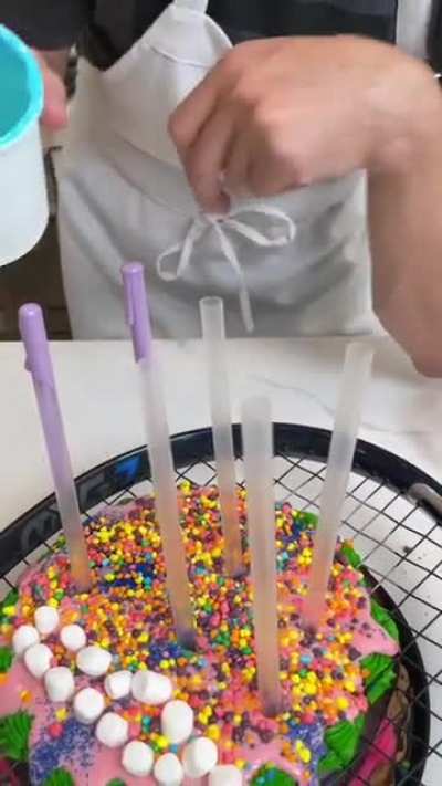 "When he pushes the racket down, the cake blooms out"