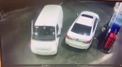 Gas Station CCTV catches man defending himself with petrol