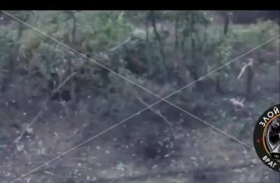 A Russian soldier shoots a Ukrainian soldier in his trench at close range. When he got closer, the Russian soldier was hit, but a bulletproof vest saved his life.