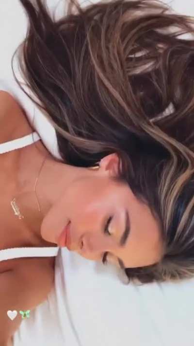 Biting her lip