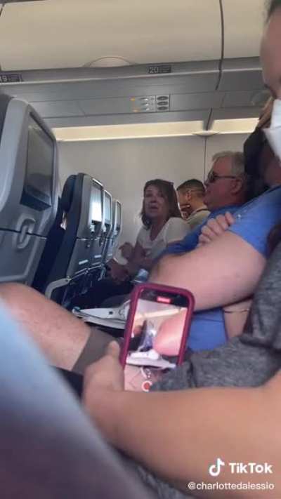 Couple on plane yelling racist and homophobic slurs were asked to deboard and they refused and made it everyone&rsquo;s problem. West Palm Beach FL