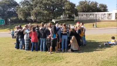 QAnon conspiracy theorists singing Country Roads in Dallas a week after JFK Jr failed to return from the dead