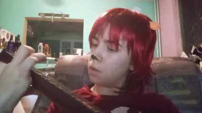 Me playing "Fire Fire" on an acoustic guitar while cosplaying as Lammy
