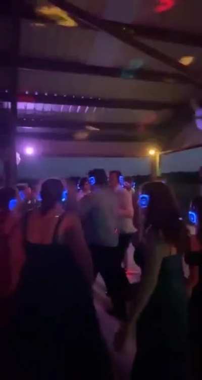 Silent rave The headphones have the music "It's fun to stay at the YMCA"