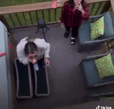 Girls take turns catching marshmallows in their mouths