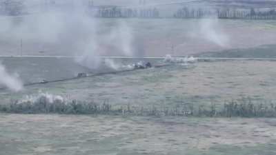 Russian "assault sheds" and a regular tank are targeted by artillery and drones while trying to clear a path from mines, the first shed returns after it's trawl fails and suffers a direct hit causing another shed to deploy a smoke screen