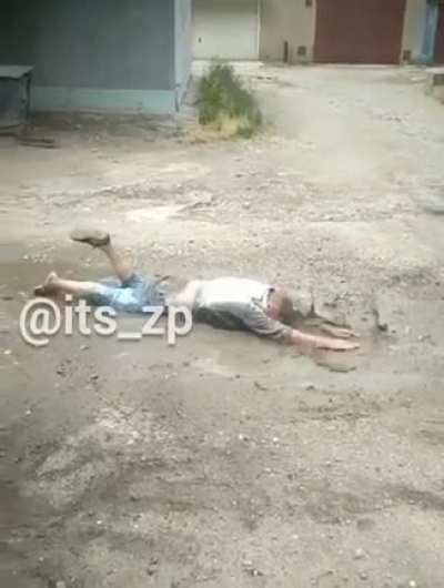 A man is being chased and tries to swim away