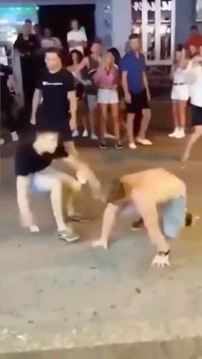 wrestler takes on two people