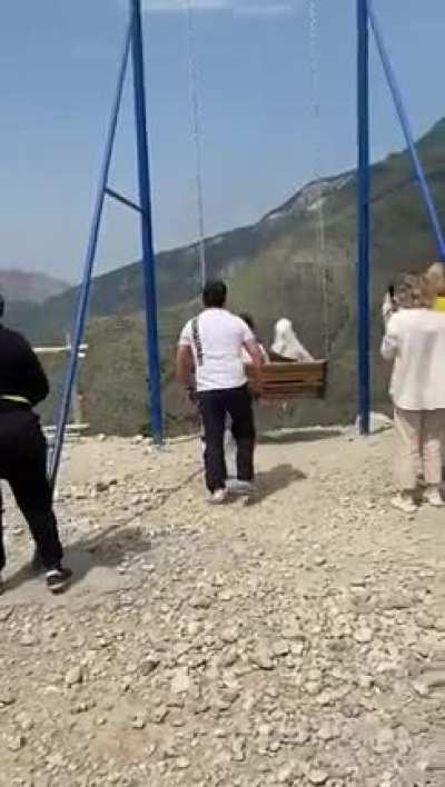 Two women fall off a swing on the top of a 6,000-foot cliff in Russia