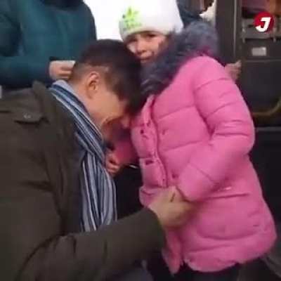 A father in Ukraine says goodbye to his kids as he sends them to safety. He is staying behind to fight for his country.