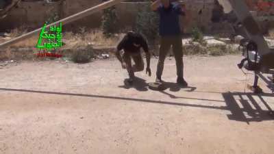 Opposition engineers build a trebuchet to launch mines converted into explosive projectiles - 5/17/2014