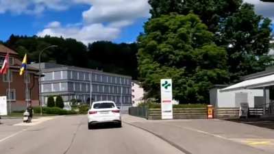 Perfectly hidden behind the white car