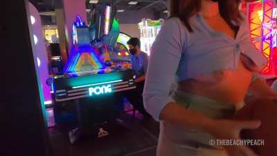 Oops, my boobs keep popping out at the arcade