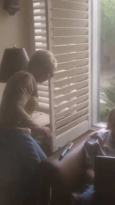 my little brother took this of my grandma trying to do my dad's hair