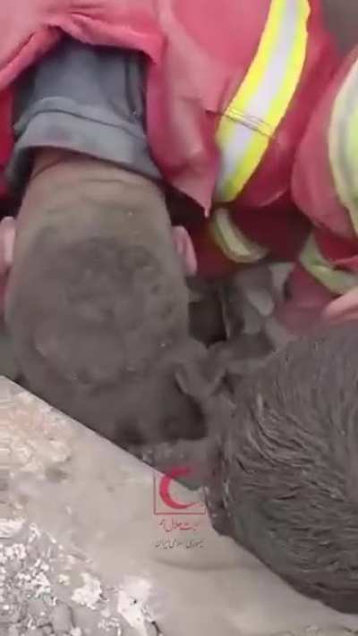 Iranian Red Crescent team rescues a man trapped under rubble after US/Israeli airstrike in Tehran