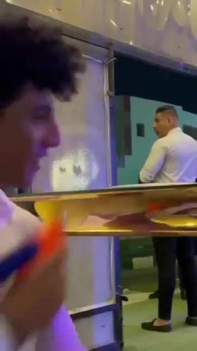 Spraying security guards with water