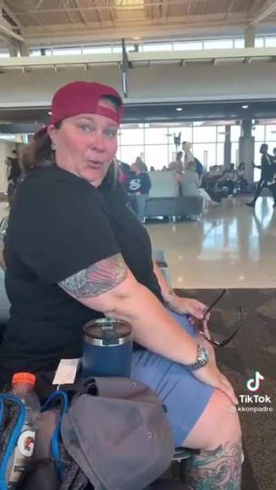 Taking a sip of a refreshing beverage at the airport