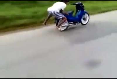 Guy stunting on his motorcycle