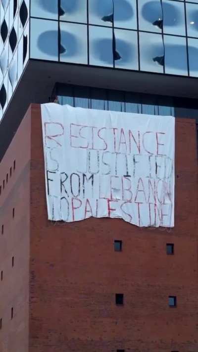 &ldquo;Resistance is justified from Lebanon to Palestine&rdquo;. Protesters release massive banner on Hamburg&rsquo;s Philharmonie.