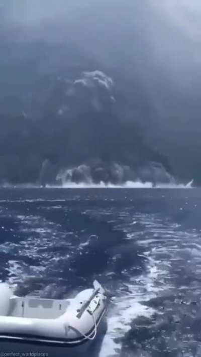 Sailing away from a volcanic eruption in Italy