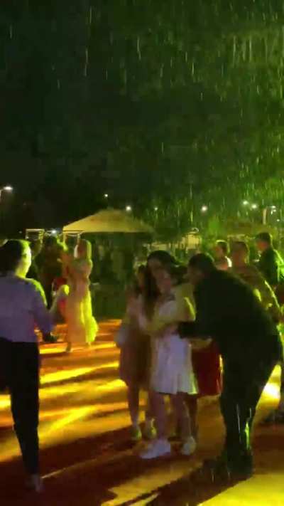 Kosovo&rsquo;s President and her family join U.S. embassy staff to perform a choreographed dance in heavy rain, celebrating the U.S. Independence Day