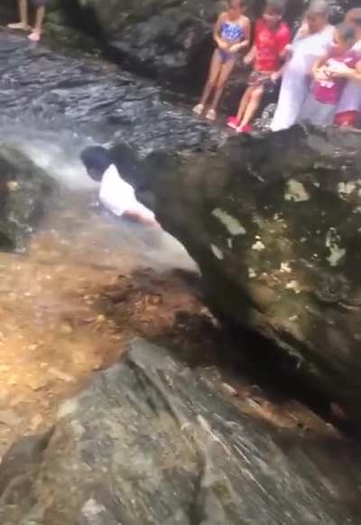 Falling down a waterfall onto rocks