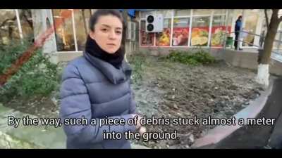 Russian news report from Feodosia, where pieces of the "Novocherkassk" landing ship have been scattered all over town. With English subtitles.