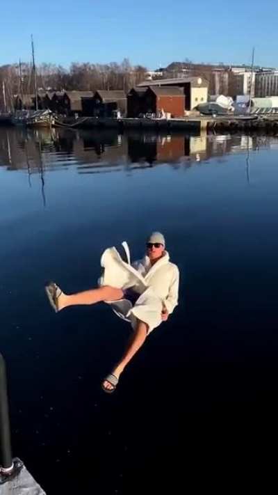 Dramatic slide into the water with the sun beaming