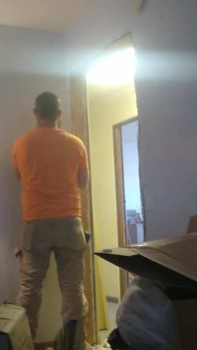 My gfs ex kicked in her door... And this is it getting fixed... He set of the fire alarm 3 times