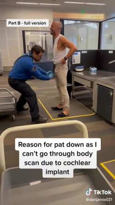 Deaf guy with a cochlear implant getting aggressively pat down in all the wrong places due to not being able to go through the scan.