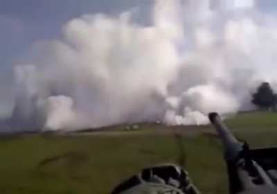Tank deploys smokescreen.