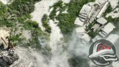Russian soldier blocks an fpv drone with an stick but gets riddle with shrapnel and fall down 