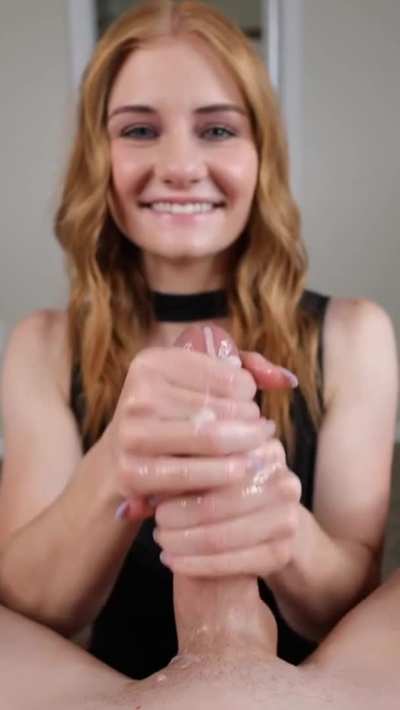 Cute Redhead Smiling While She Strokes Him