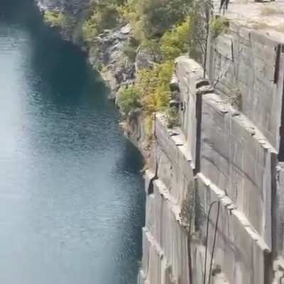 Diver makes a ridiculous and life-threatening jump &amp;amp; flip off of a quarry wall.