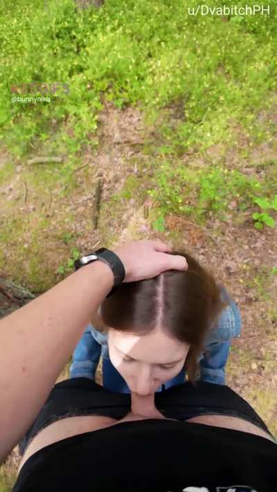 In the woods pushing my head deeper till I gag on his cock