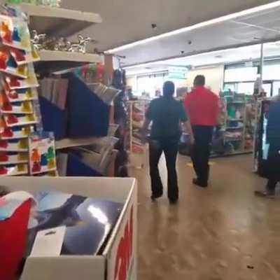 Dollar store employee has a bad trip at work.