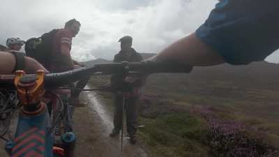 Mountain Bikers randomly bump into King Charles on a solitary walk.
