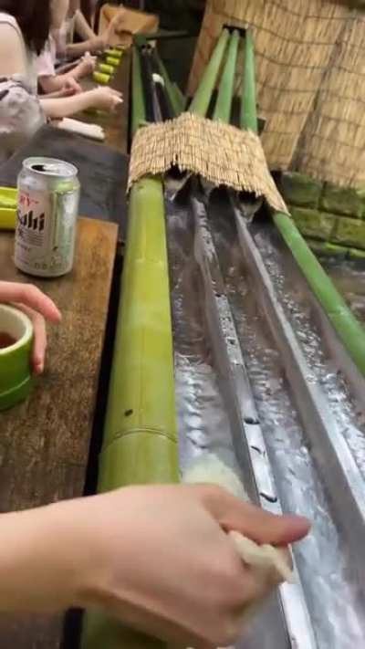 Nagashi somen is an eating style where you &ldquo;catch&rdquo; noodles with chopsticks as they make their way down a stream of flowing water
